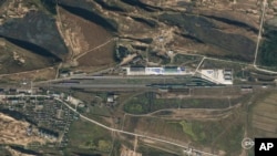This satellite photo from Planet Labs PBC shows increased activity at the Tumangang Rail Facility in North Korea, on Oct. 5, 2023. (Planet Labs PBC via AP)