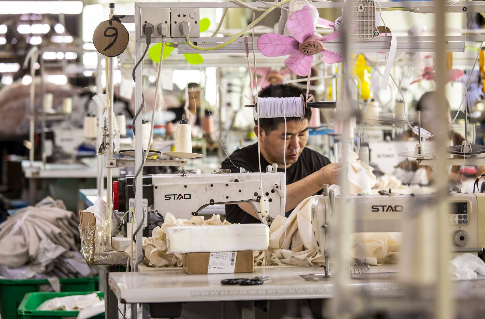 Workers at a garment factory in Guangzhou, China. Photo: Bloomberg