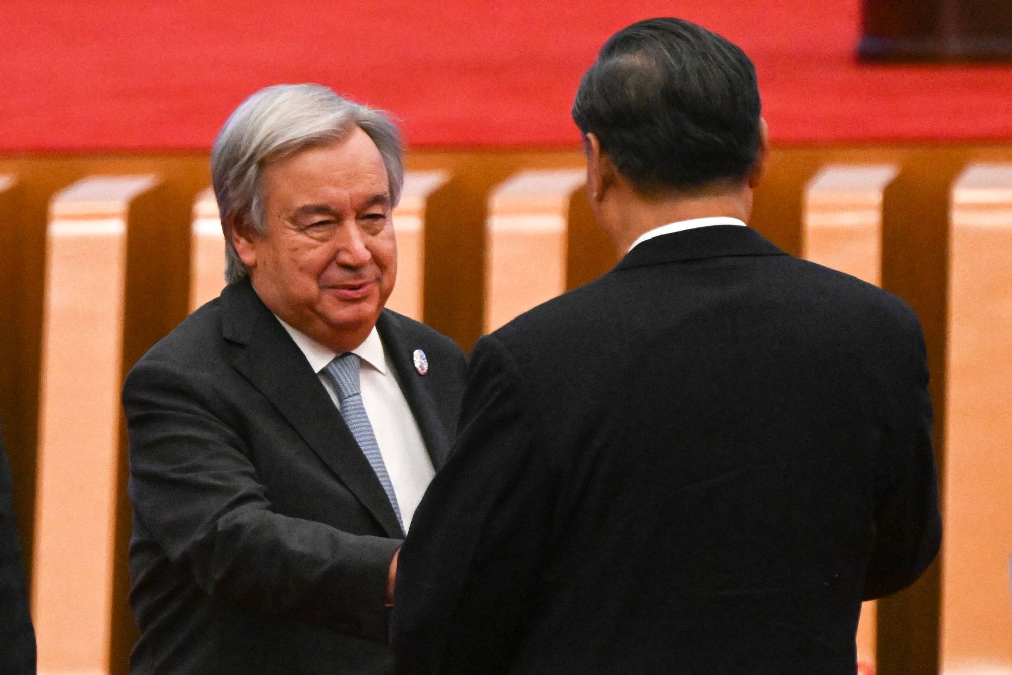 Xi Jinping shakes hands with UN Secretary General Antonio Guterres at the forum in Beijing on Wednesday. Photo: AFP