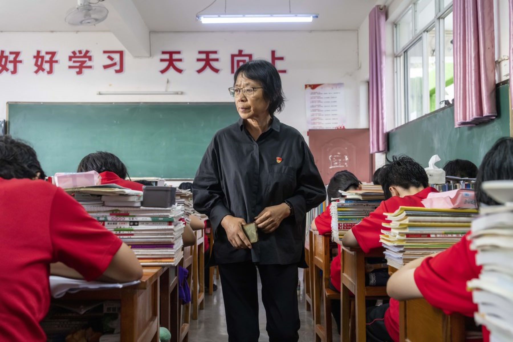 Zhang Guimei watches over her students as they do their coursework, in Huaping county of Lijiang city, Yunnan province, in 2020. Photo: Xinhua