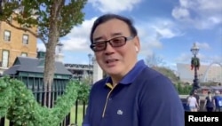 FILE - Yang Hengjun is seen at an unidentified location in this still image from an undated video obtained via social media. (Twitter @yanghengjun)