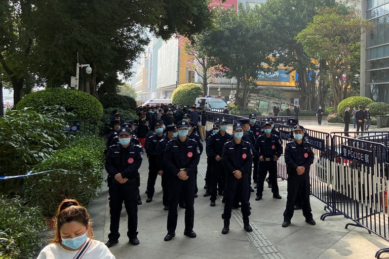 ENG_CHN_MassPolicing_11142023.3.JPG Police officers stand guard outside the Evergrande International Center in Guangzhou, Guangdong province, China, Jan. 4, 2022. Credit: David Kirton/Reuters