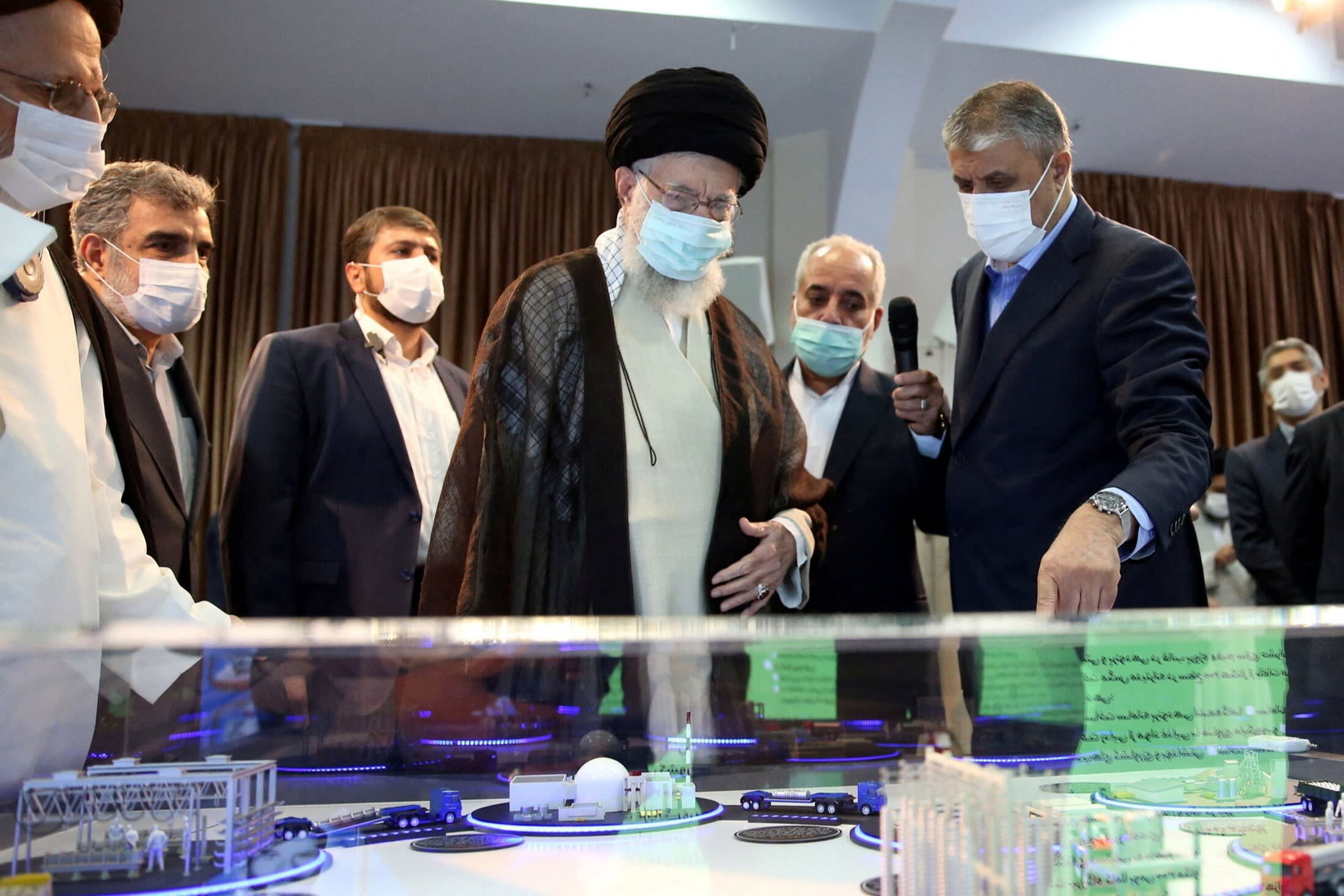 Iran’s Supreme Leader Ayatollah Ali Khamenei views a model of a nuclear facility, in Tehran