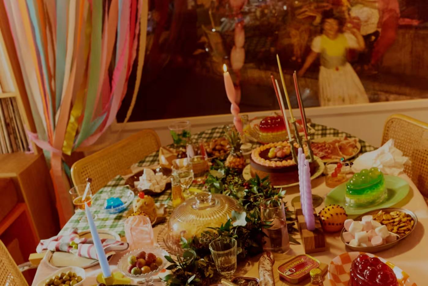 A table laid with desserts by Laura Jackson