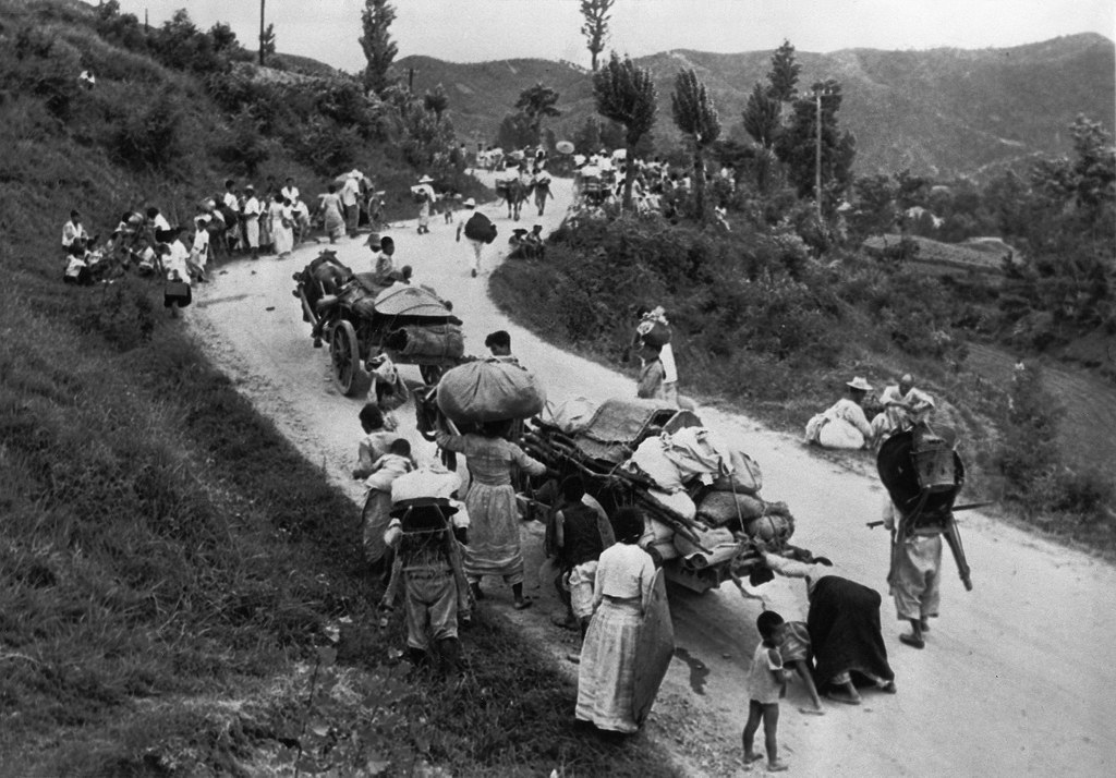 North Korea’s surprise offensive drove defenders and fleeing civilians behind a defensive line in a small area known as the “Busan Perimeter.” Pictured: South Korean civilians walk on a road leading south in Aug. 1950. Credit: AP
