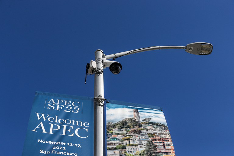 ENG_CHN_APECProtest_11142023_04.jpg A security camera next to a banner for Asia-Pacific Economic Cooperation summit in San Francisco, California, Nov. 11, 2023. Protesters are planning a large-scale event on Wednesday against the Chinese President Xi Jinping in San Francisco on Wednesday, on the sidelines of the APEC leader’s meeting. Credit: Jason Henry/ AFP