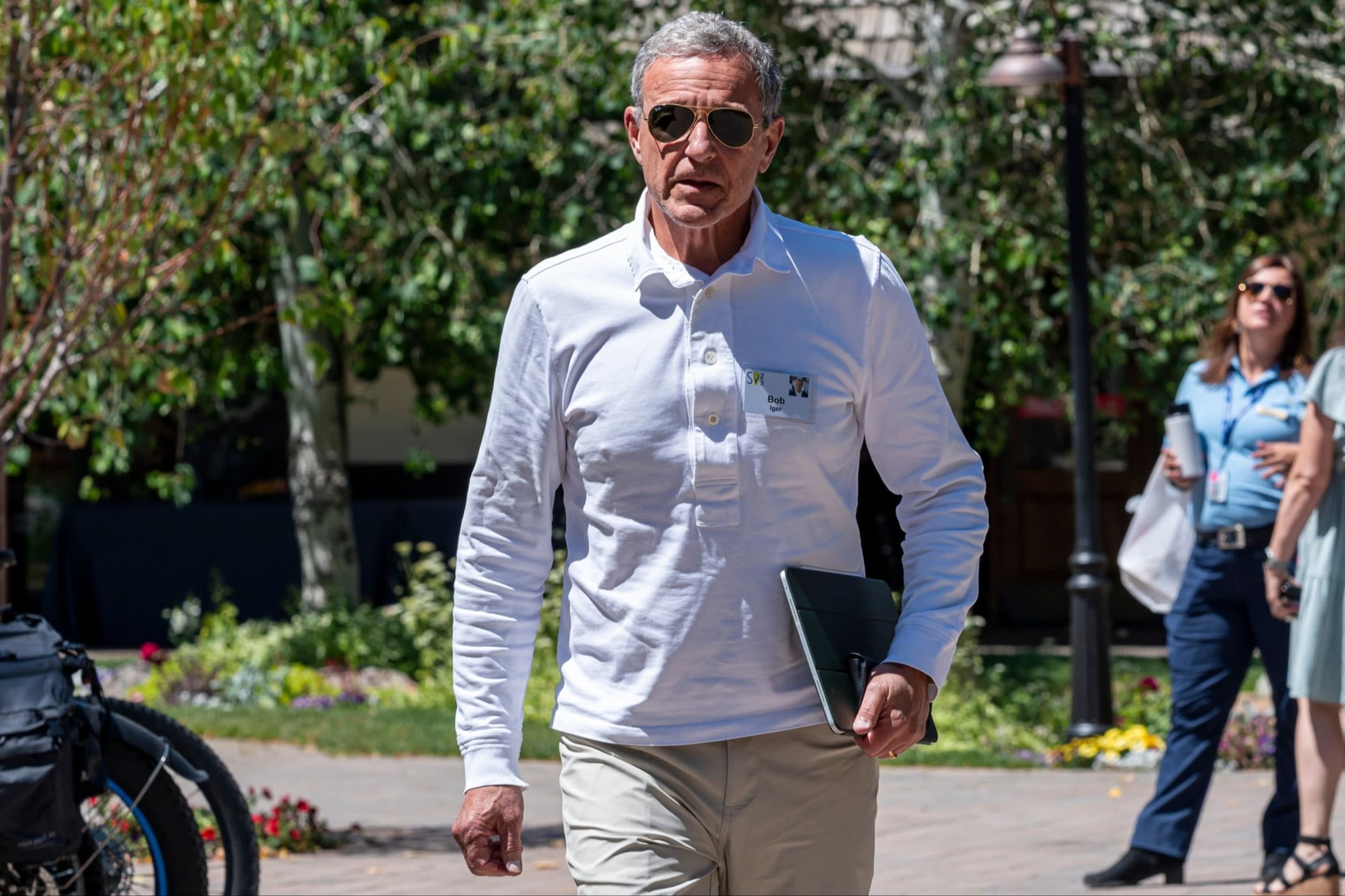 Disney chief executive Bob Iger walks outside to a meeting