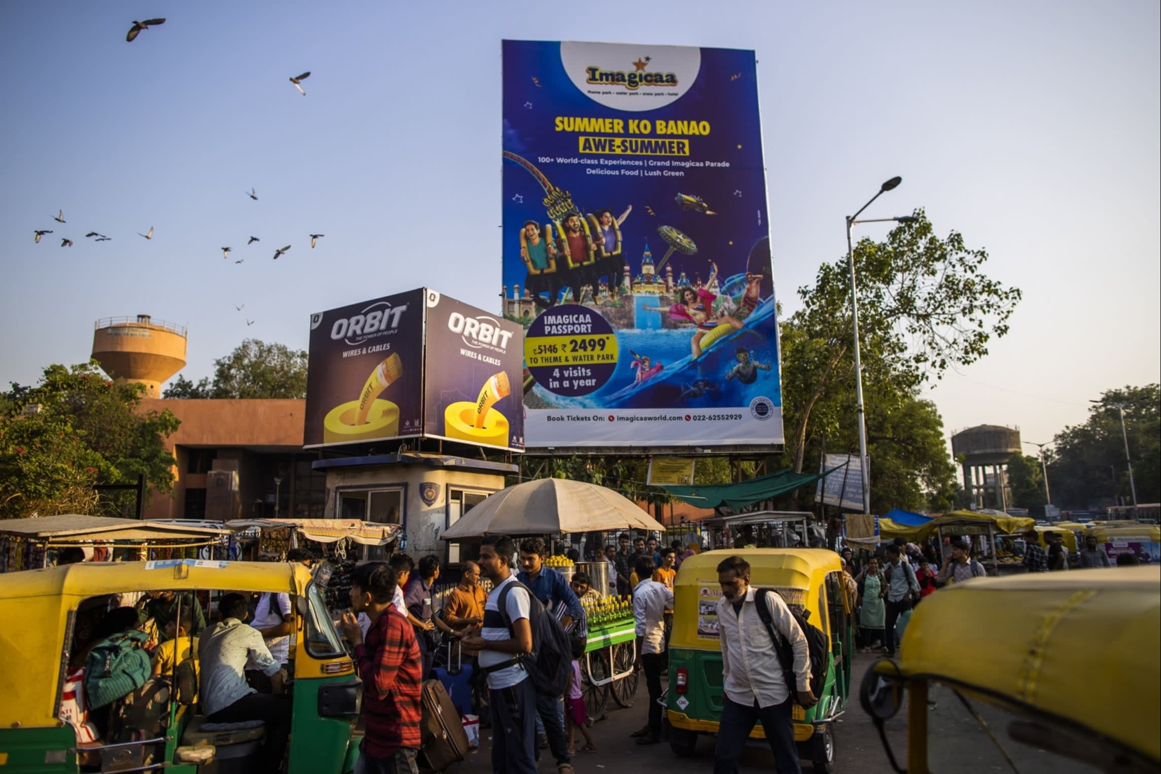 People and vehicles crowd a street
