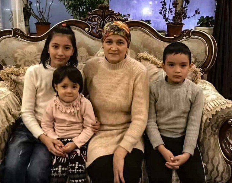 Shehide, 13, Nehdiye, 5, their mother Qemernisa Abdurahman, 48, and Abdurahman, 9, are seen in an undated photo. All four – as well as another child of Abdurahman – died in the residential building fire in Xinjiang’s capital Urumqi on Nov. 24, 2022. Credit: Handout