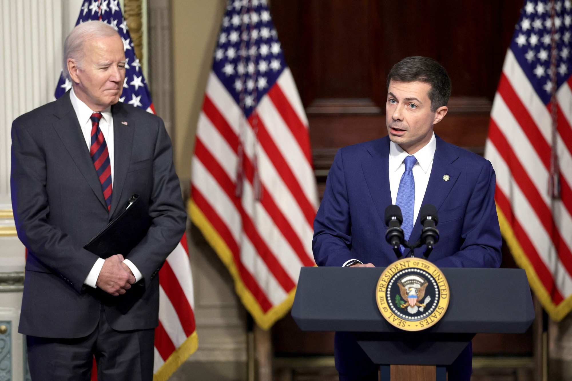 US Transportation Secretary Pete Buttigieg talks about supply chains while introducing President Joe Biden at the White House on Monday. Photo: Getty Images via AFP