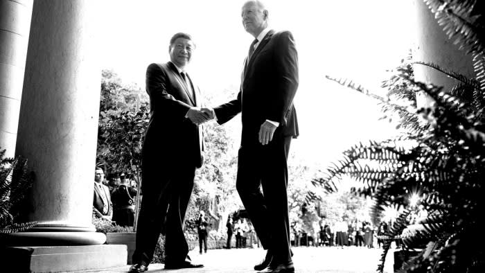 A black and white photo of President Joe Biden and President Xi Jinping shaking hands