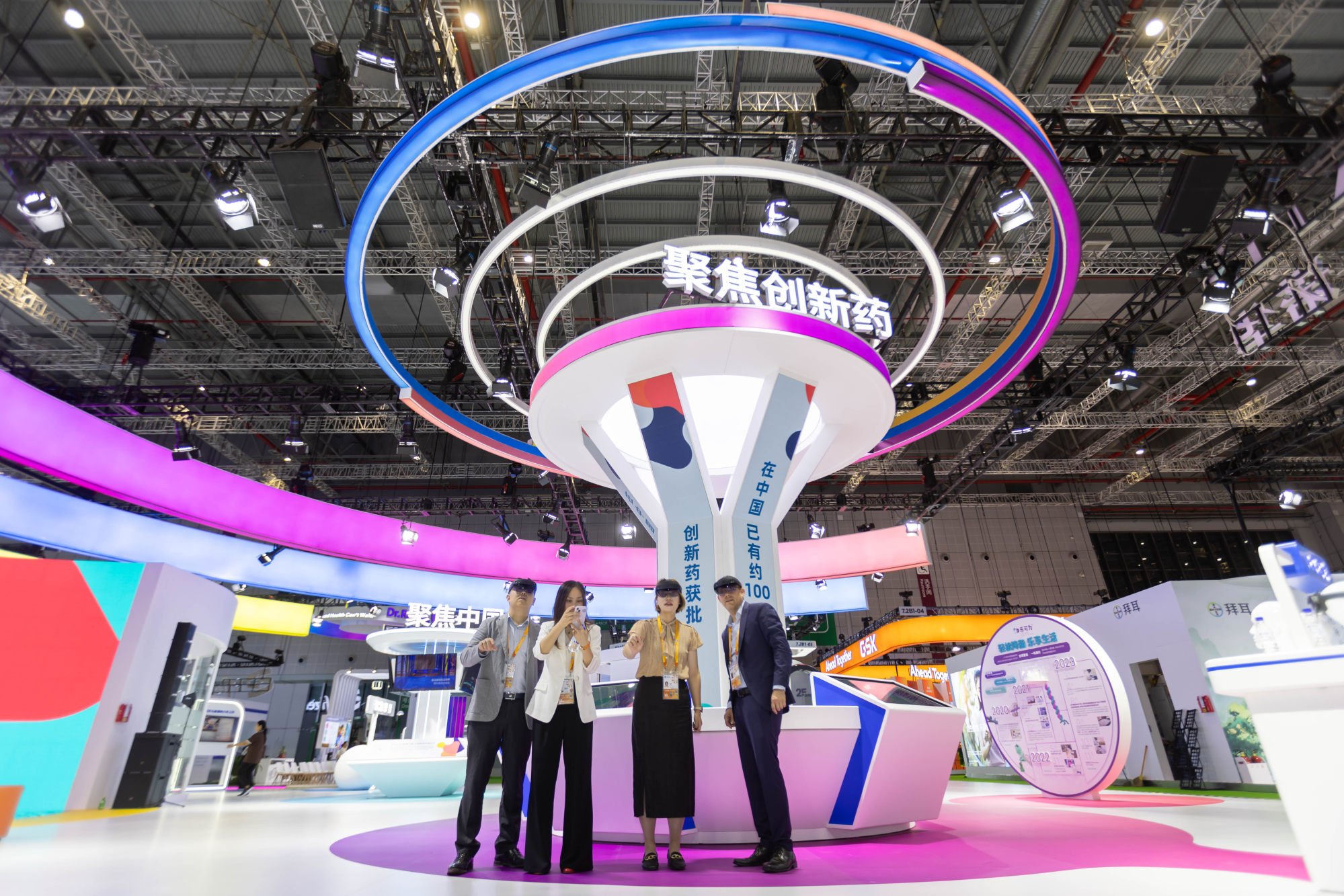 Participants use VR devices at the Novartis booth at the 6th China International Import Expo in Shanghai on November 5. Photo: Xinhua