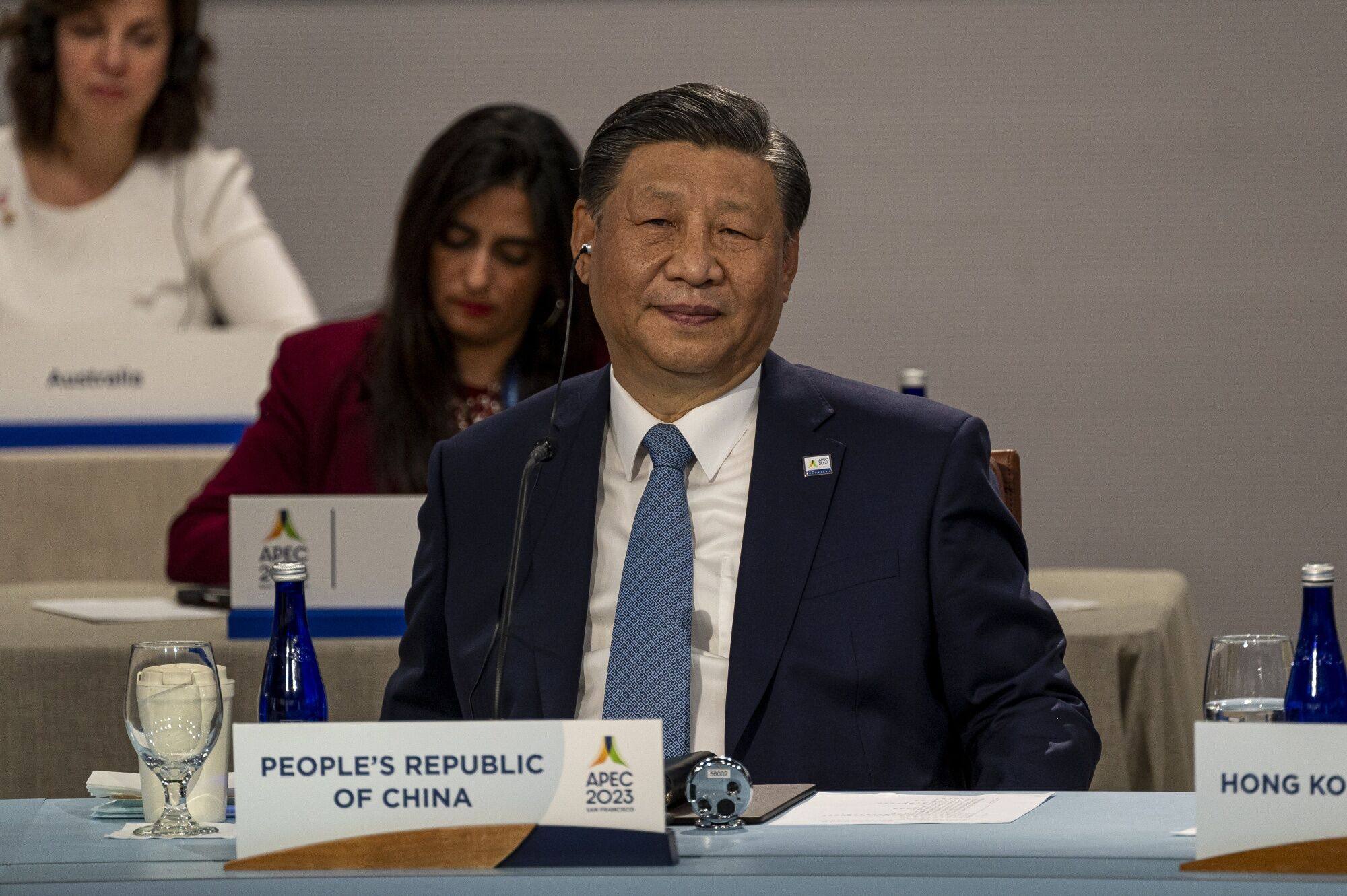 Chinese President Xi Jinping listens during an Asia-Pacific Economic Cooperation meeting in San Francisco on Friday. Xi’s attendance at the annual conference had been uncertain until just before it began. Photo: Bloomberg