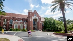 FILE - Students are seen walking on the campus of Florida State University in Tallahassee, Florida, April 30, 2015.