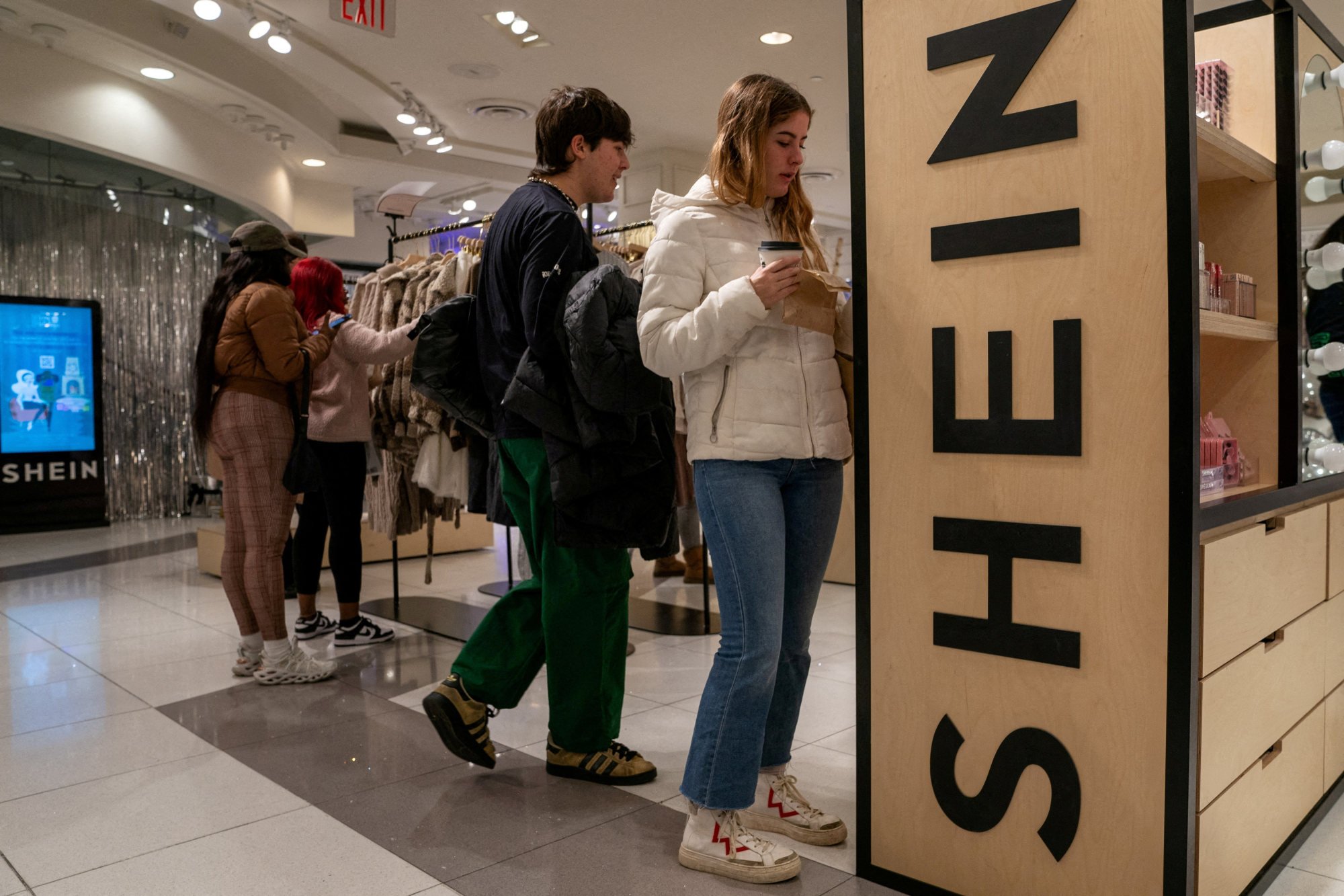People shop at Shein’s holiday pop-up store inside the Forever 21 branch at Times Square in New York City on November 10, 2023. Photo: Reuters