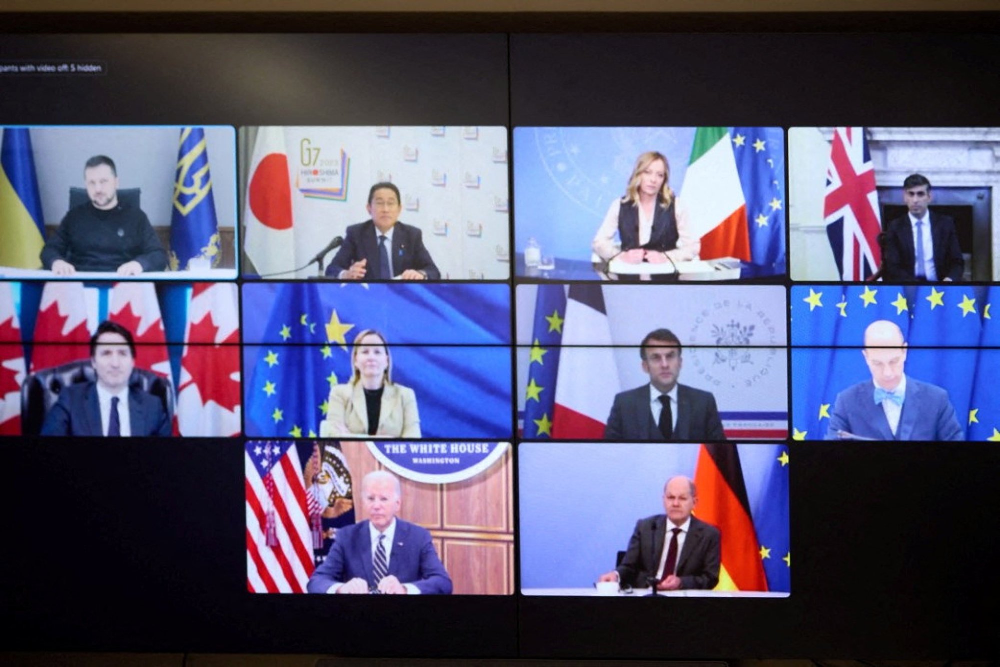 The G7 summit leaders appear on a monitor during a video conference with Ukrainian President Volodymyr Zelensky on Wednesday. Photo: Handout via Reuters
