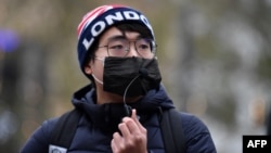 FILE - Simon Cheng, founder of Hongkongers in Britain, attends an event in Leicester Square, central London, on Dec. 12, 2020.
