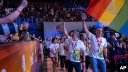 FILE - The delegation of Hong Kong arrives at the stadium during the opening ceremony of the Gay Games in Hong Kong, Nov. 4, 2023.