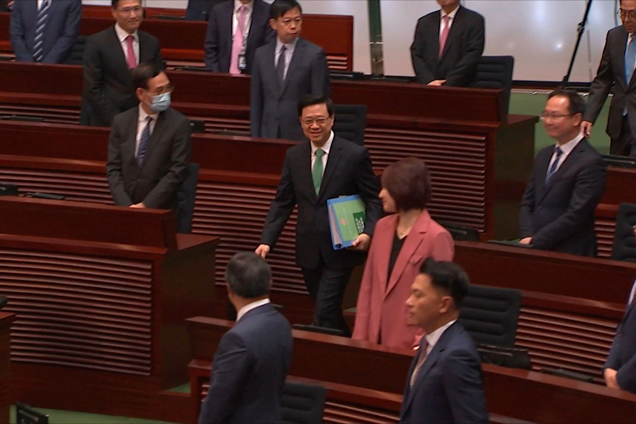 Hong Kong Chief Executive John Lee enters the Legislative Council meeting room to deliver a policy address in Hong Kong