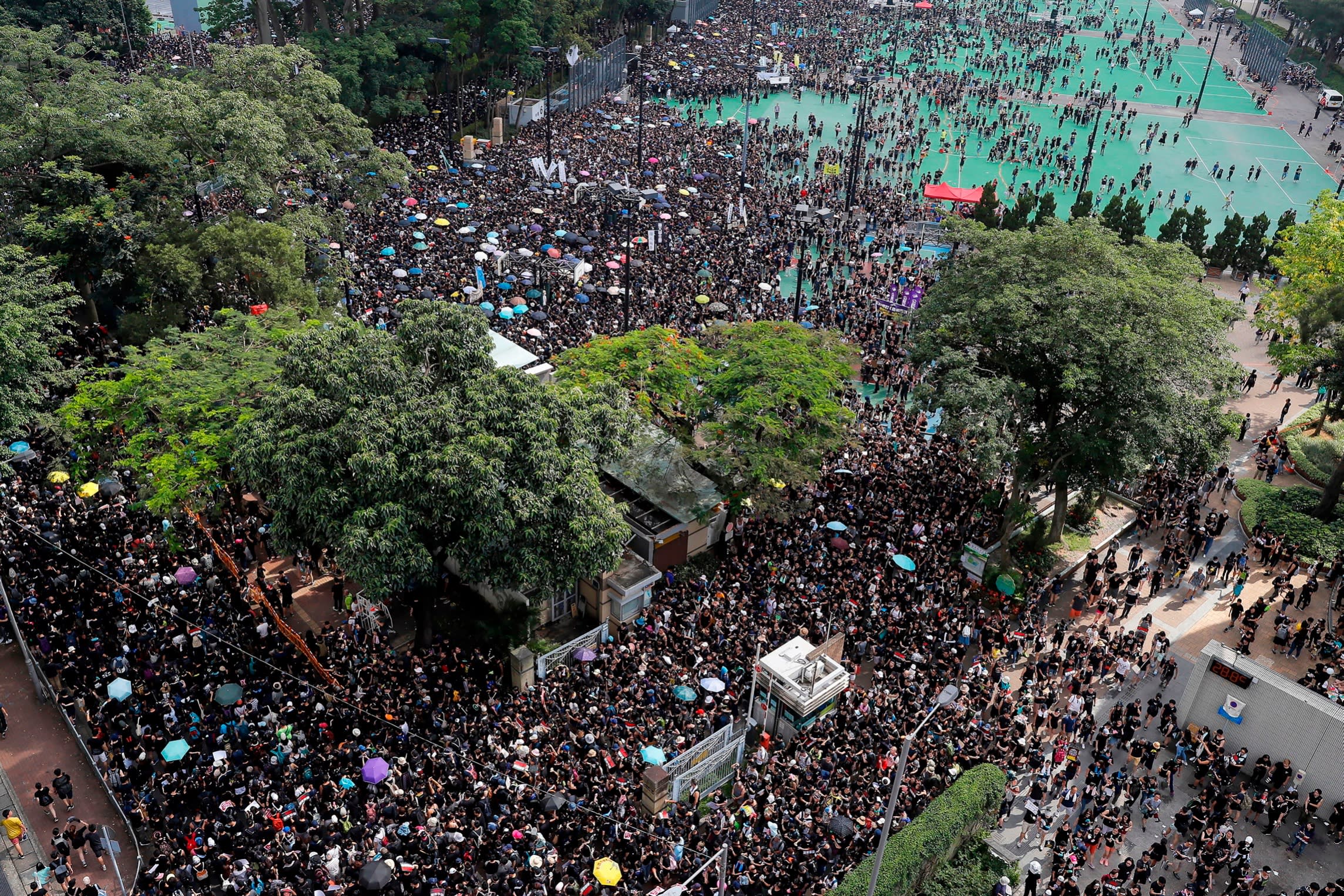 Thousands of protesters leave Victoria Peak to march through the streets to continue protesting against the extradition bill in 2019