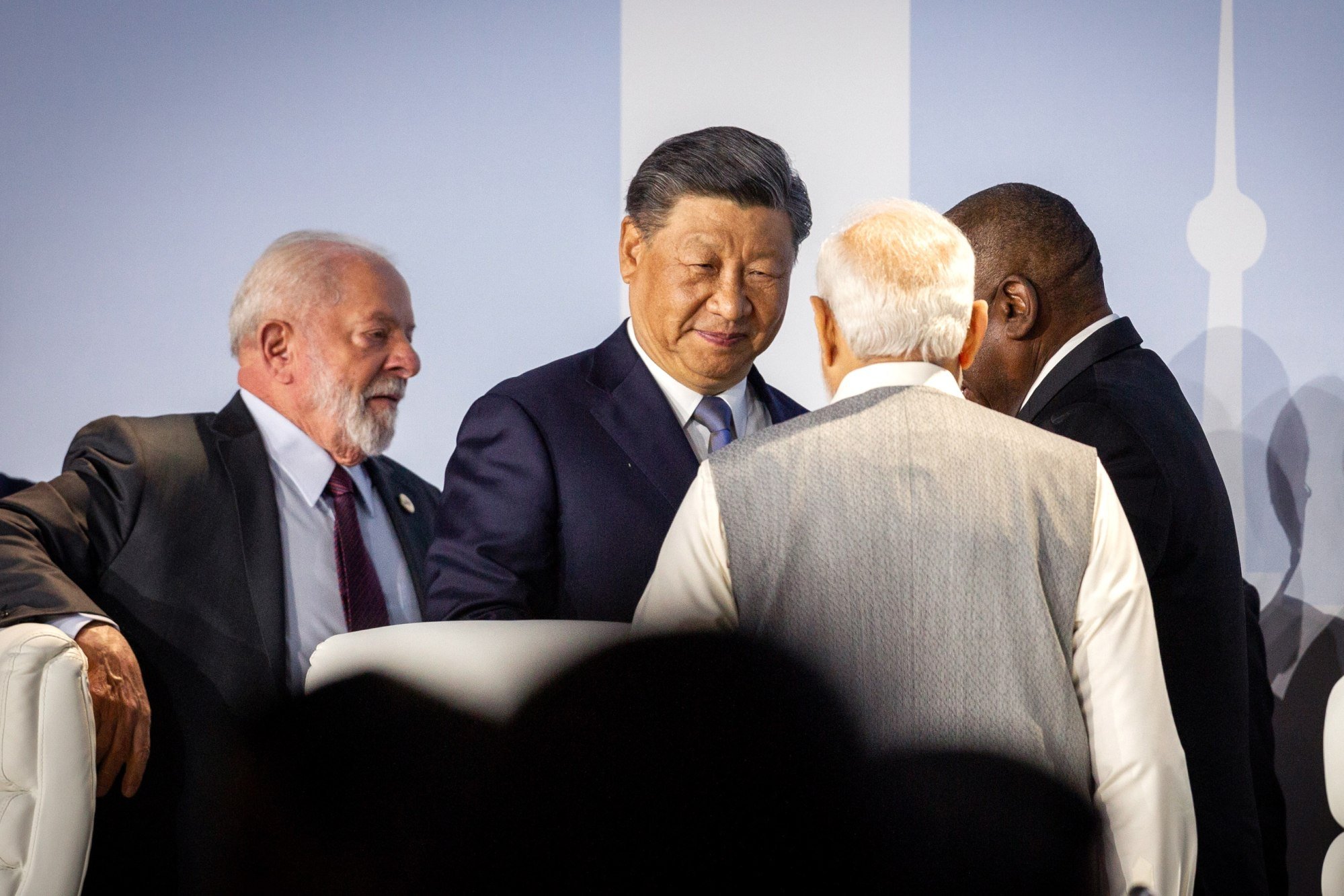 Chinese President Xi Jinping (centre) and Indian Prime Minister Narendra Modi meet as they attend a Brics meeting in Johannesburg, South Africa, in August. The two leaders visited each other in 2018 and 2019. Photo: EPA-EFE