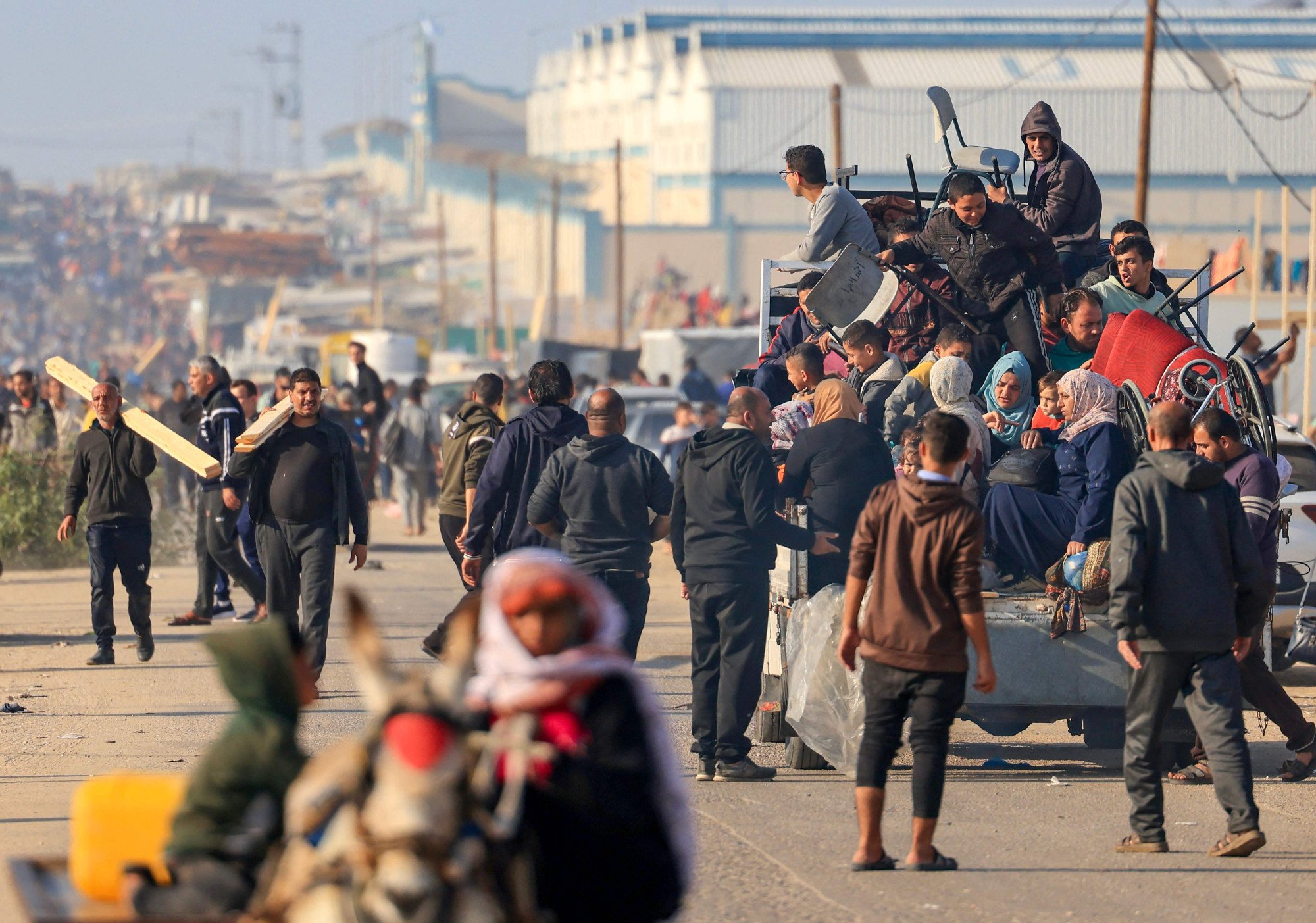 Palestinians flee from Khan Yunis to Rafah in the southern Gaza Strip on Monday, after the Israeli army called on people to leave certain areas in the city. Photo: AFP