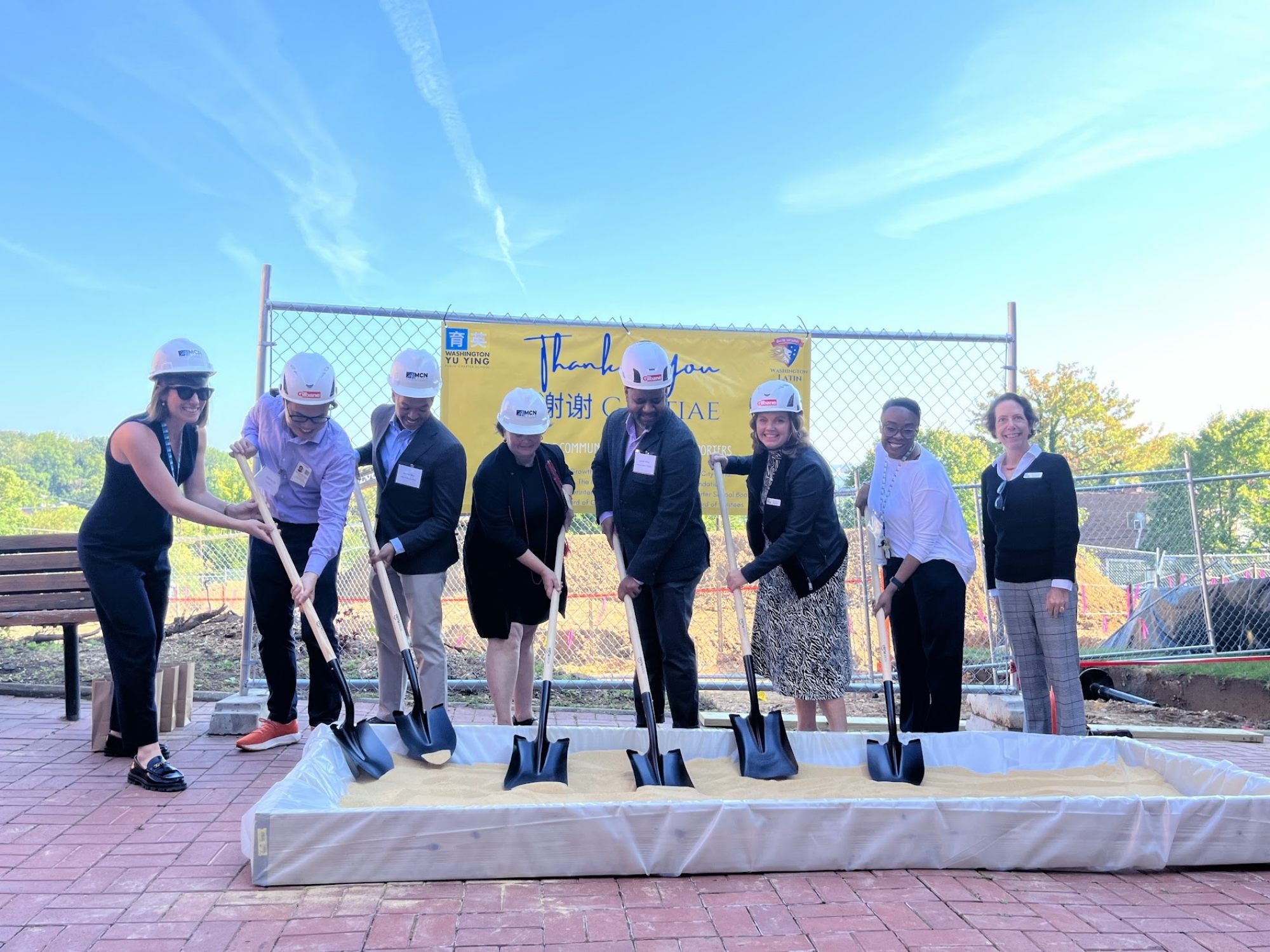 Carlie Fisherow (third from right) and others from Yu Ying Charter Public School and Washington Latin, another public charter school, at an event marking their campus expansion in Washington DC. Photo: Yu Ying Charter Public School