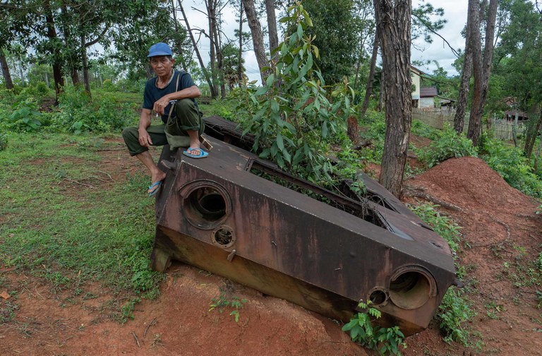 tank-1.jpg A Lao man sits on the remains of a Soviet-era tank in Xieng Khouang, northeastern Laos, June 27, 2023. Credit: Tran Viet Duc/RFA