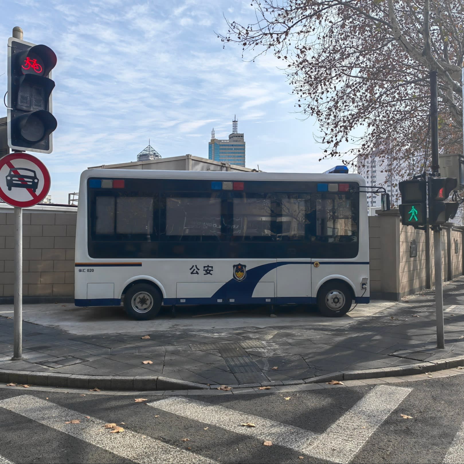 An unused police vehicle parked on the corner of two roads