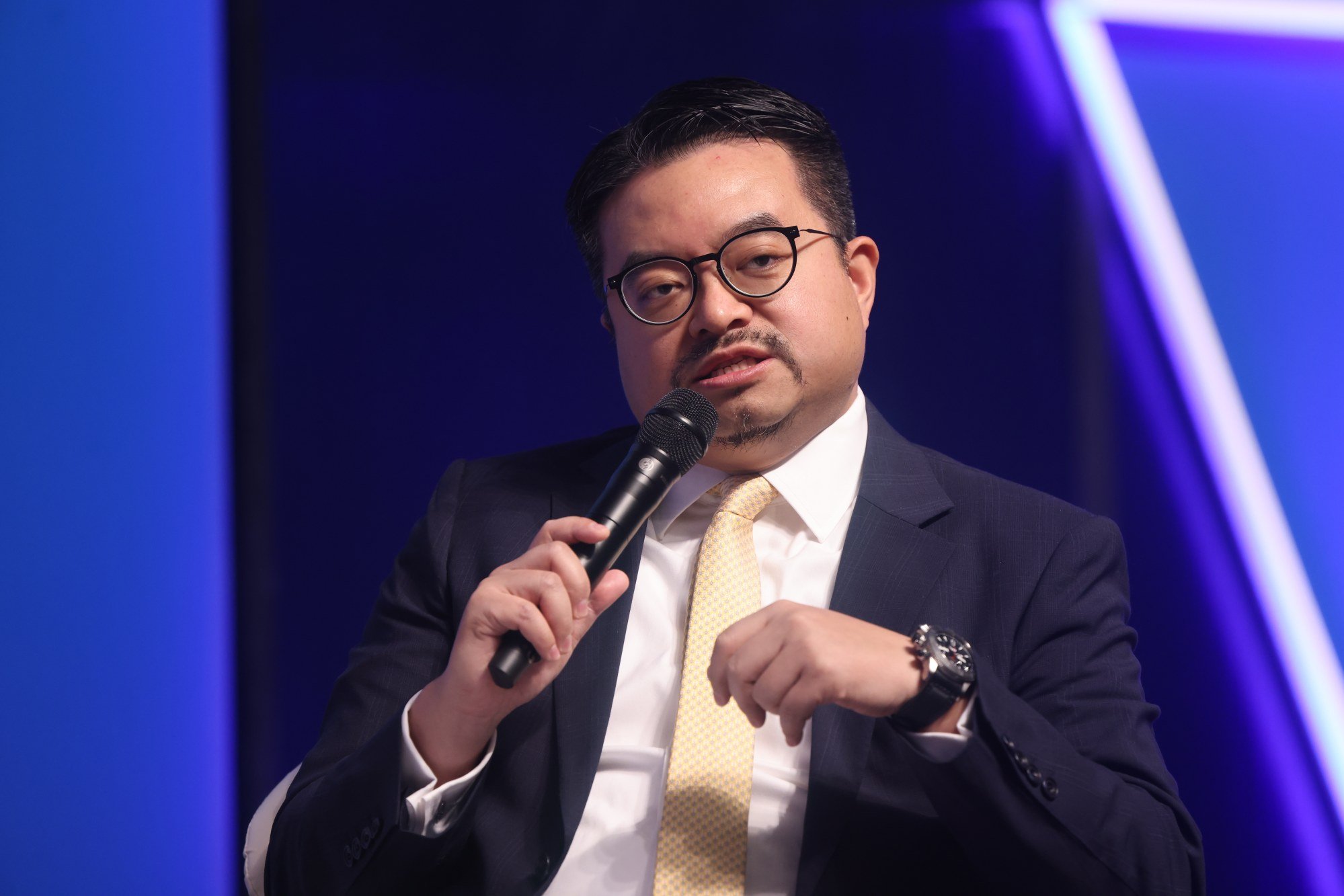 Edward Lau Fu-keung, chief financial officer of New World Development, spoke at a panel discussion on the yuan’s internationalisation during the Asian Financial Forum at the Convention and Exhibition Centre (HKCEC) in Wan Chai on 25 January 2024. Photo: Jonathan Wong
