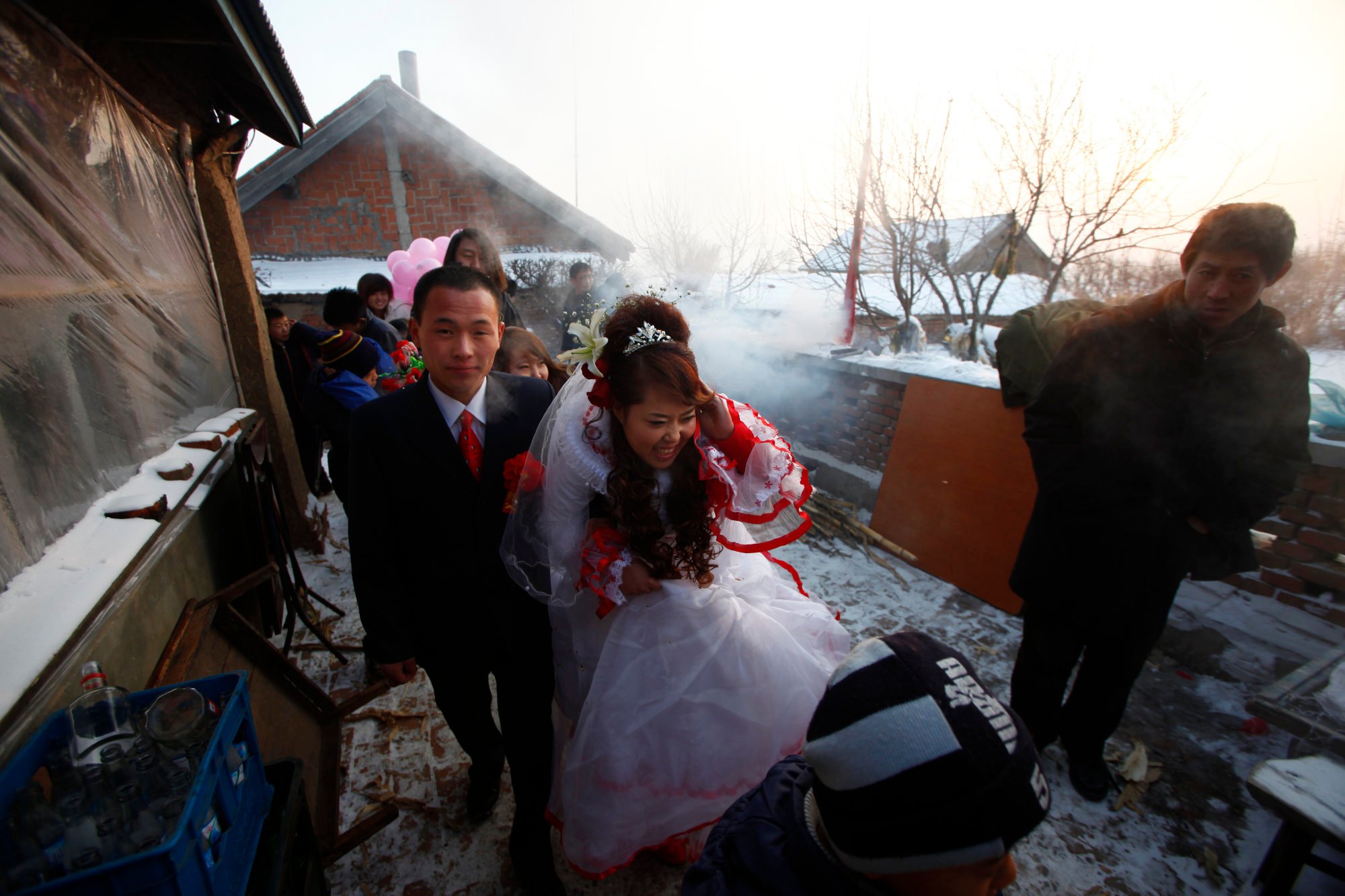 A young couple in Yushu, Jilin province, get married in December 2009. Traditionally in China, it is customary for the groom-to-be to give a sum of money to the bride’s family to secure the marriage. Photo: Getty Images