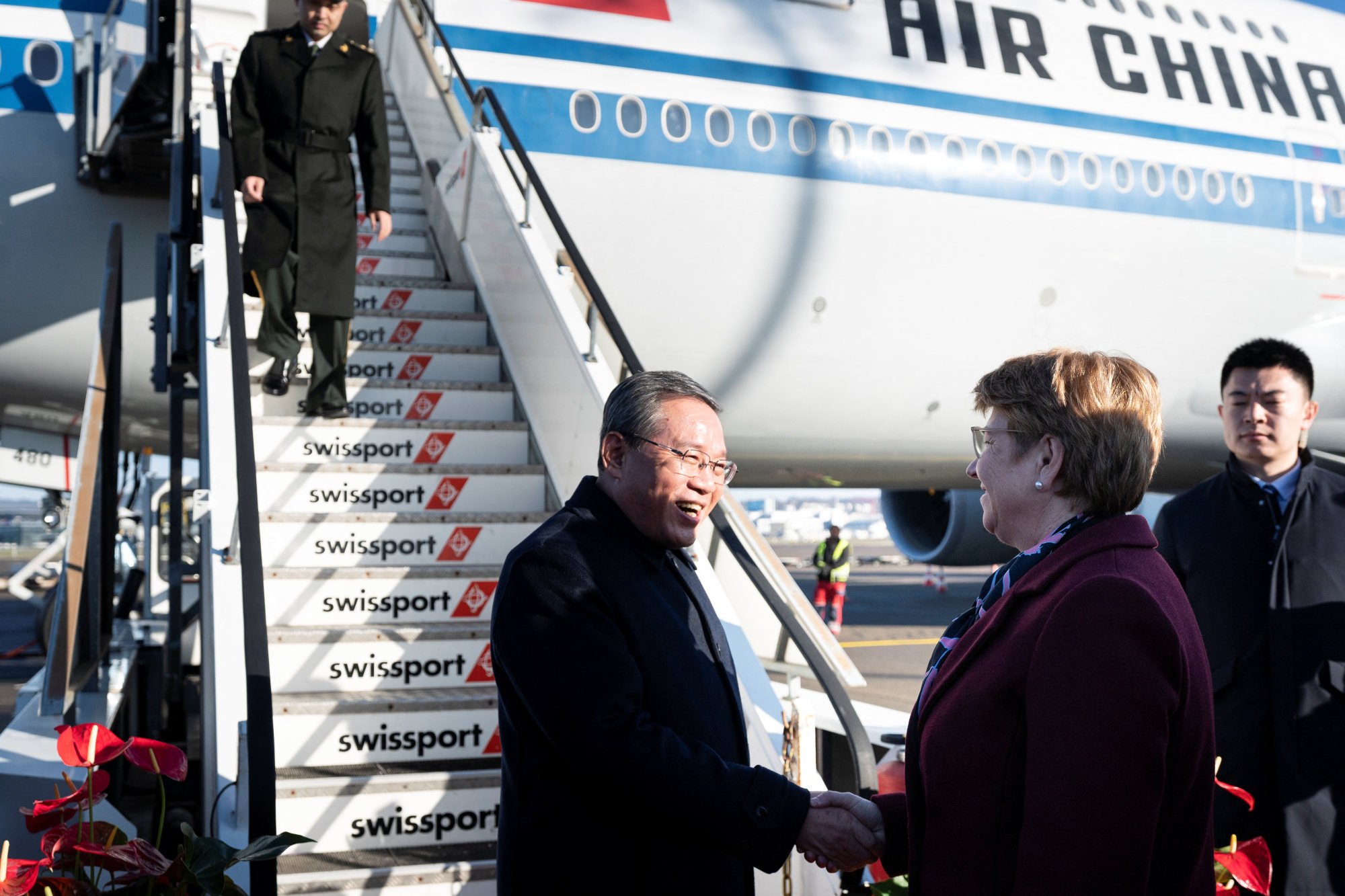 Premier Li Qiang is received by President Viola Amherd upon arrival in Switzerland. Photo: Pool via Reuters