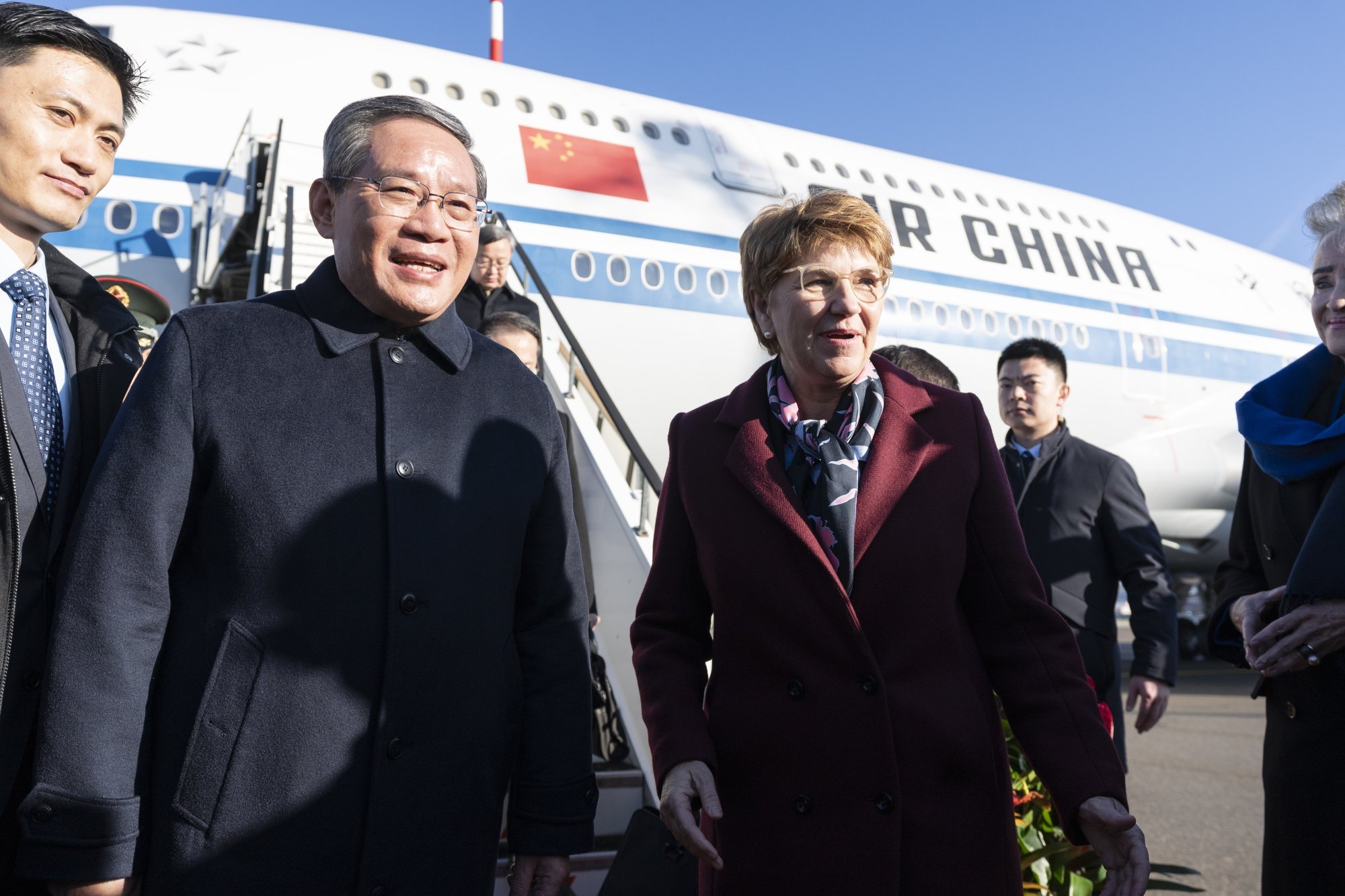Swiss President Viola Amherd, right, welcomes Chinese Prime Minister Li Qiang and his delegation upon their arrival at Zurich Airport in Switzerland on Sunday. Photo: EPA-EFE