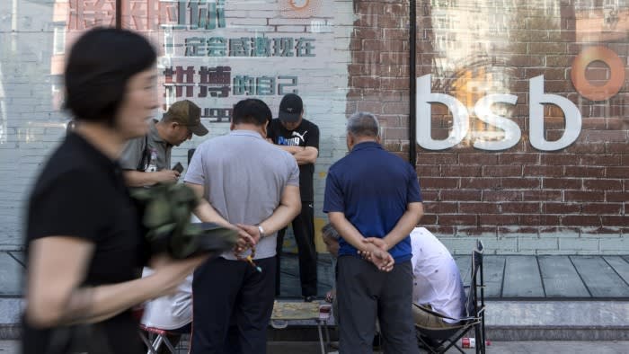 People outside a Baoshang Bank branch in Beijing