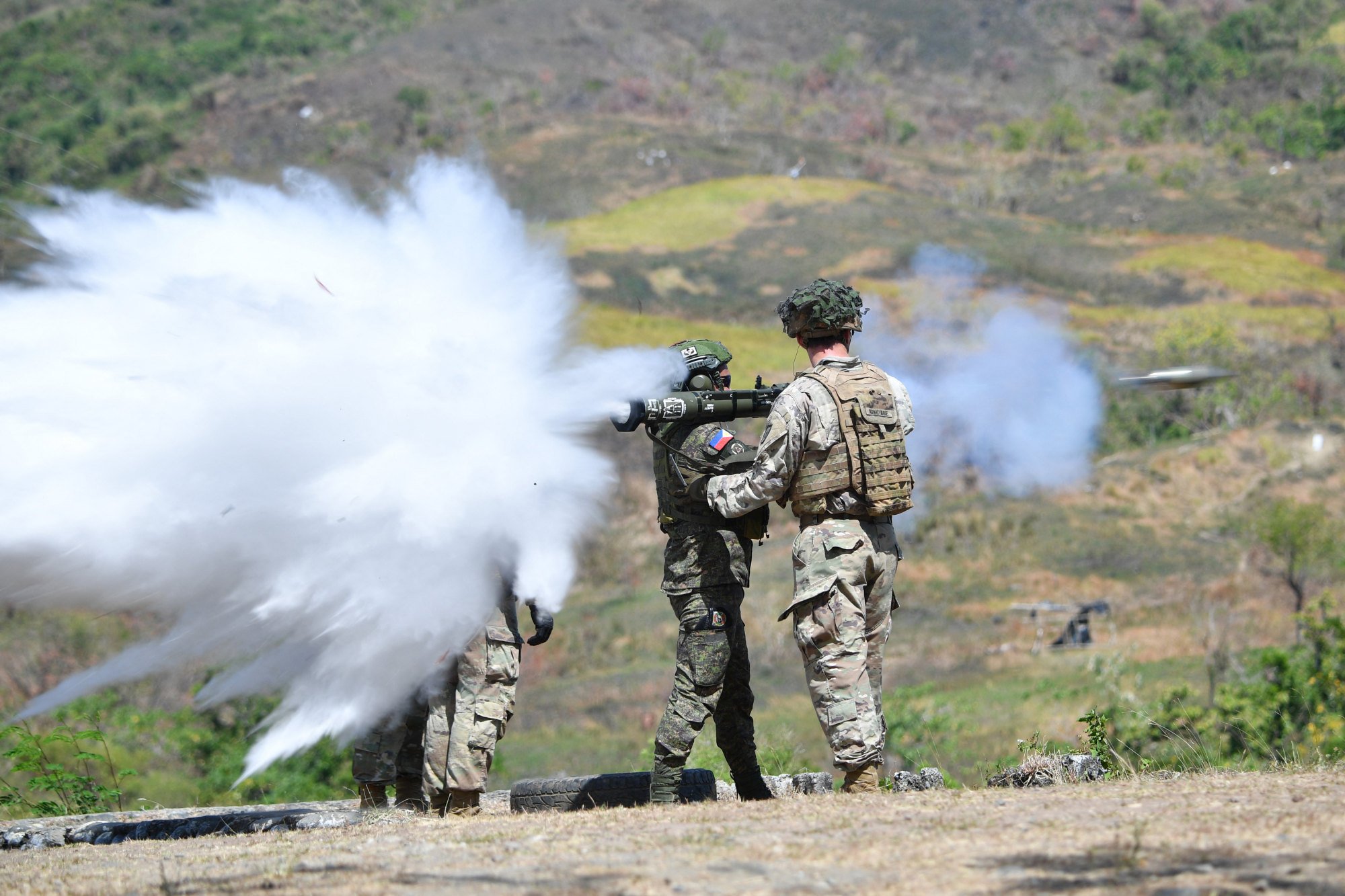 A US soldier supervises as a Philippine soldier fires an anti-tank round during a joint exercise. Photo: AFP