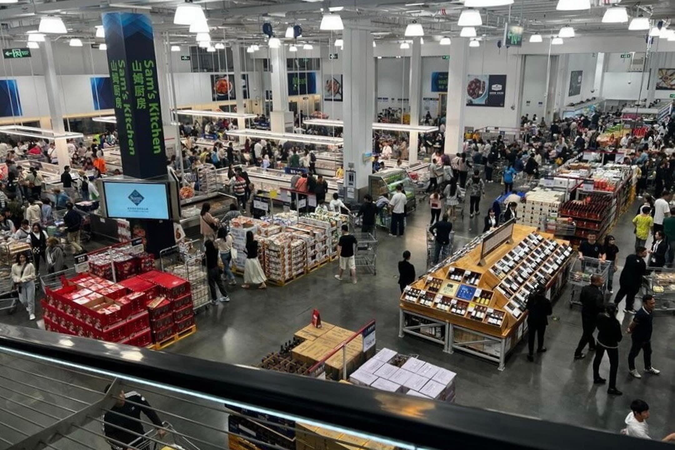 People shopping at a Sam’s Club warehouse