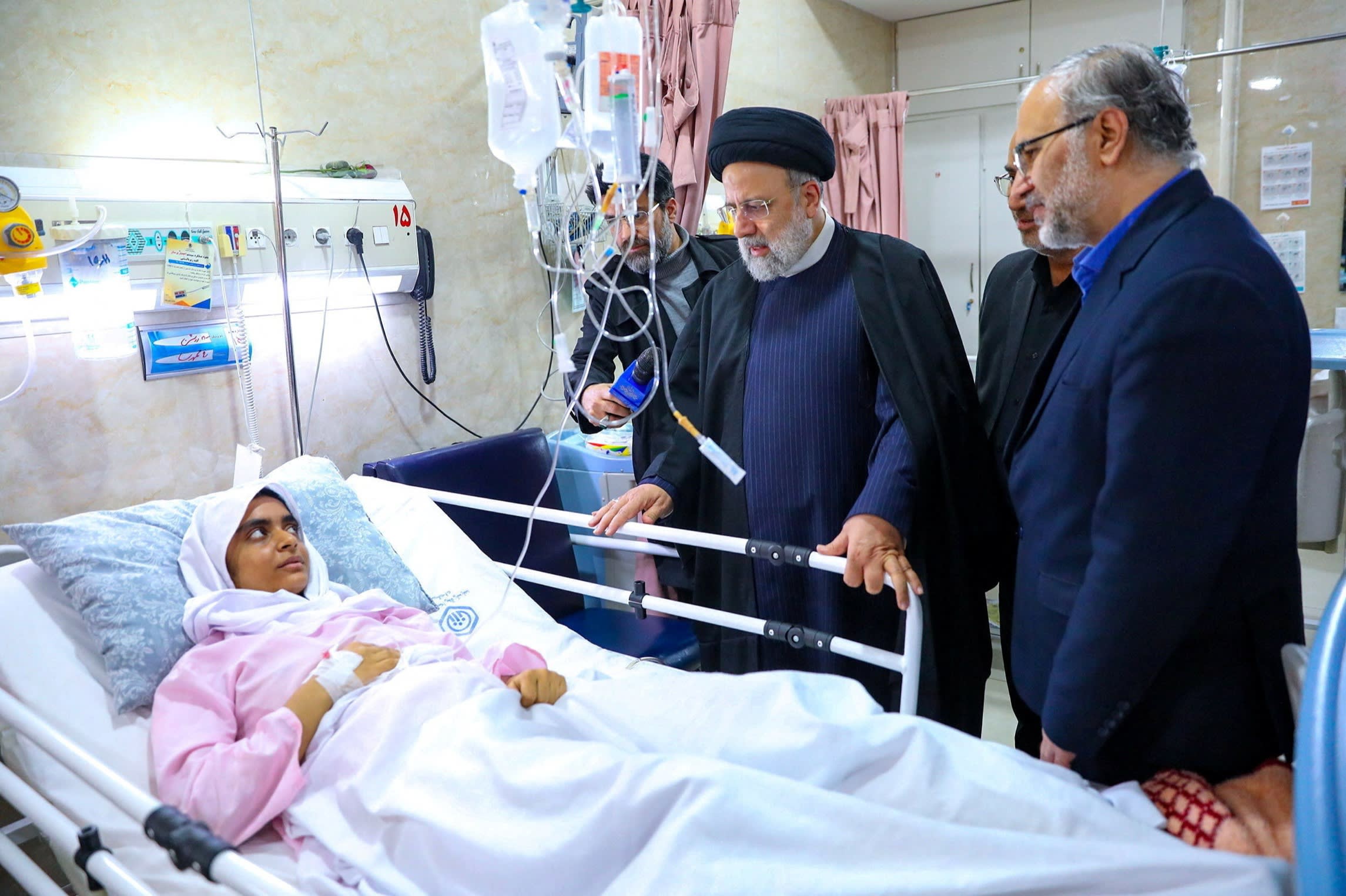 Iran’s President Ebrahim Raisi talks to a person injured in the Isis attack in Kerman. The jihadist group claimed responsibility for the attack, but only after Revolutionary Guards’ commanders blamed Israel