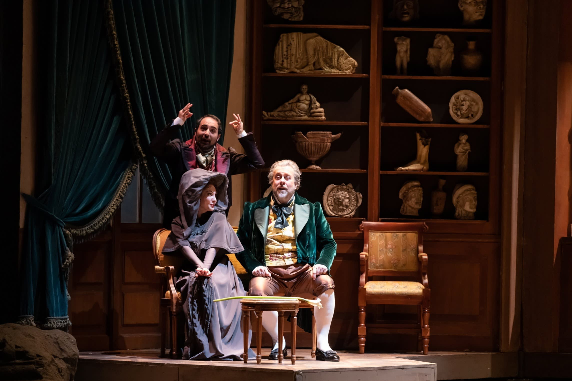 Two men and a woman in mid-19th-century Italian clothing in ‘Don Pasquale’