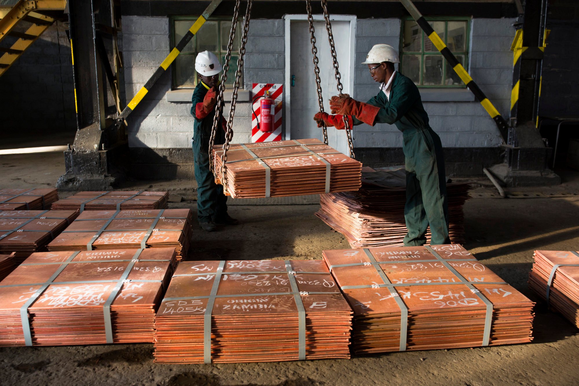 Workers move batches of copper sheets at a warehouse in Mufulira, Zambia in 2016. The US, European Union and China are all backing rail projects linking Zambia’s copper belt to African ports. Photo: Getty Images