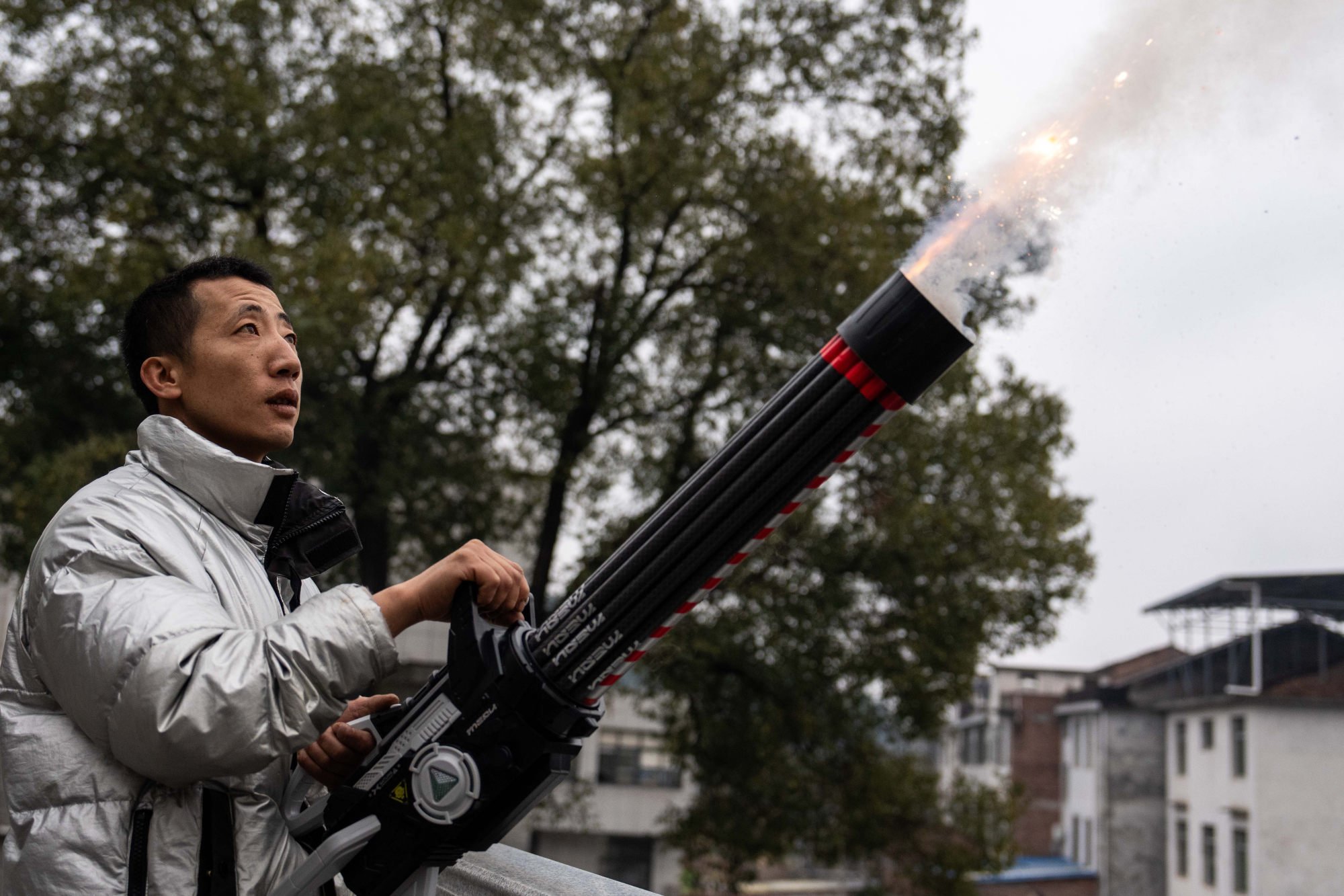 A staff member of a fireworks company tests a new product in Liuyang city in central China’s Hunan province, on January 30. The use of fireworks and firecrackers is now strictly regulated in China. Photo: Xinhua