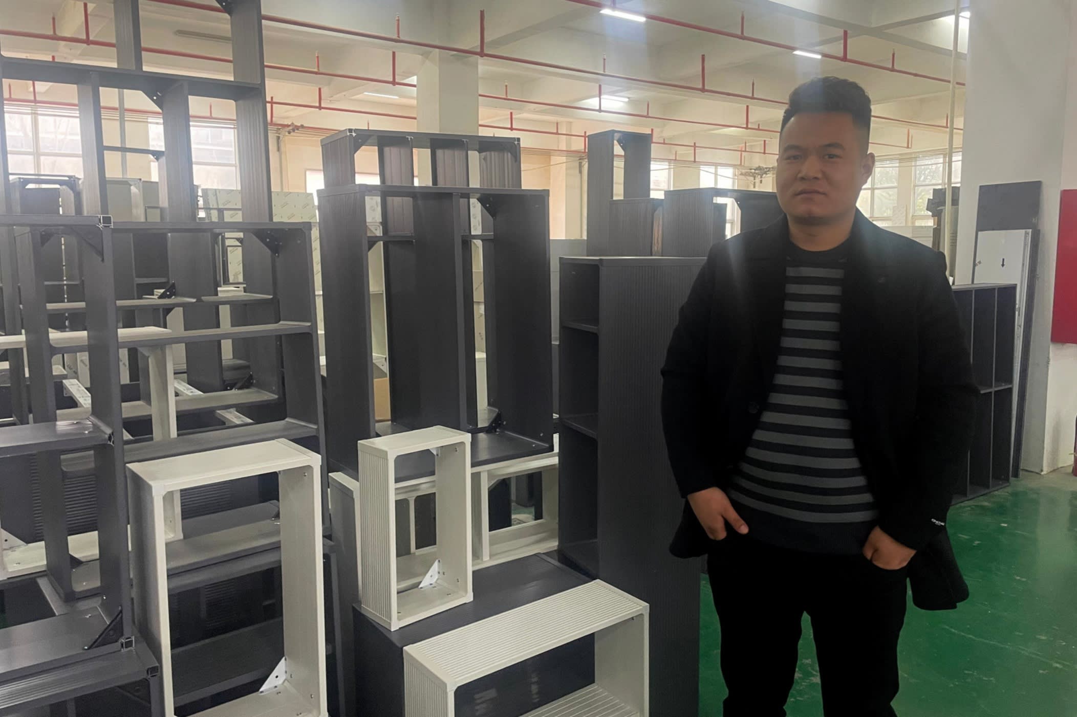 Li Su stands in his furniture factory in Shaji, one of Alibaba’s ‘Taobao villages’
