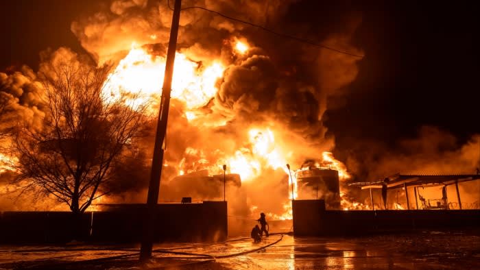 Firefighters tackle a blaze after a Russian attack on a Kharkiv neighbourhood this month
