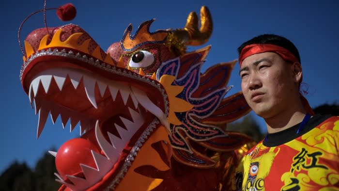 A dragon dancer prepares to perform at a temple fair on the sixth day of the Lunar New Year of the Dragon in Beijing