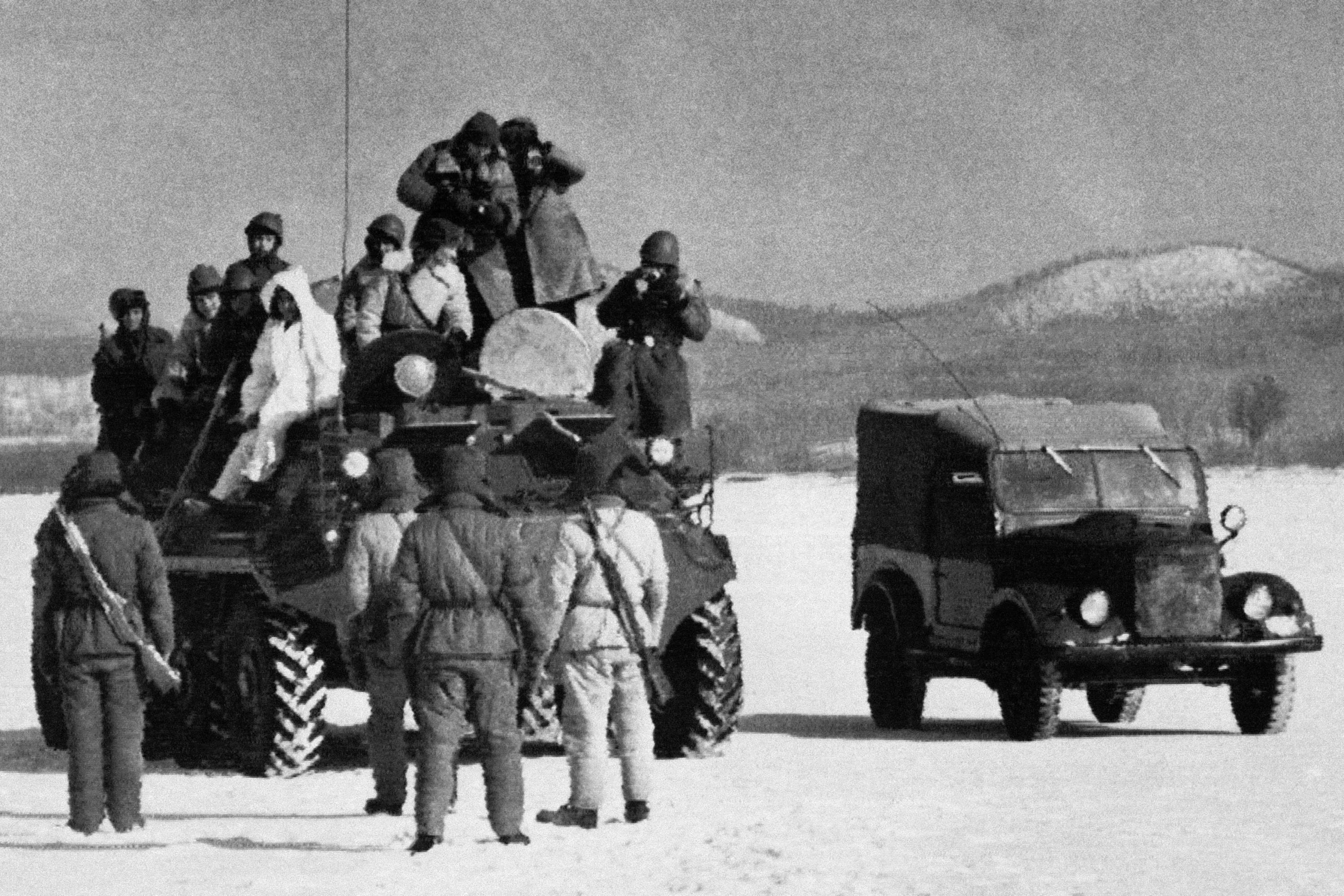 Chinese soldiers confront Soviet troops on a disputed island at the border between the two countries in 1969