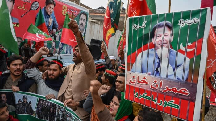 Supporters and activists of Pakistan Tehreek-e-Insaf party shout slogans during a protest demanding the release of PTI leader Imran Khan, in Peshawar