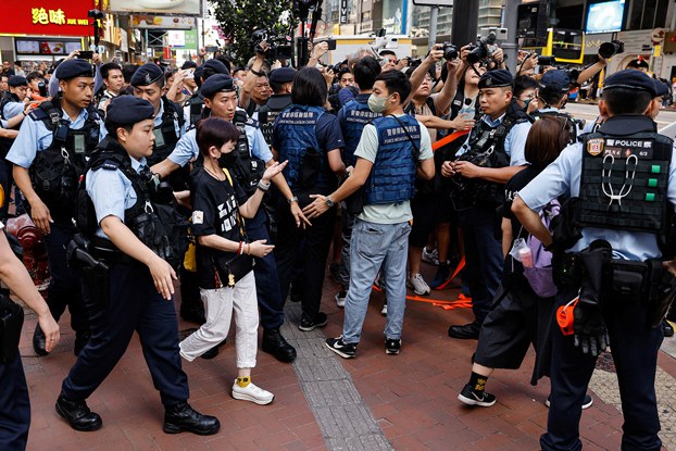 ENG_CHN_INTERVIEWFrankDikotter_02222024.9.jpg Police detain a person in downtown Hong Kong on the 34th anniversary of the 1989 Beijing's Tiananmen Square crackdown, near where the candlelight vigil is usually held, June 4, 2023. (Tyrone Siu/Reuters)