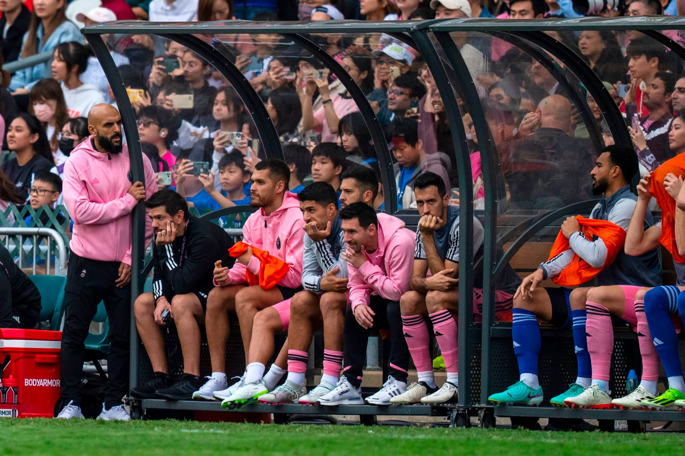 Lionel Messi, sixth from left, looks on from the bench during the friendly match between Inter Miami and a Hong Kong XI on Sunday