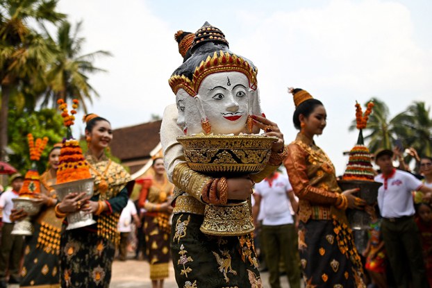 1_LAO_LuangPrabangUNESCO_01242024.1.jpg Miss Laos New Year carries a replica of King Kabinlaphom's head during the annual Laos New Year or 'Pi Mai' celebrations at the Wat Xiengthong Buddhist temple in Luang Prabang, Laos, April 15, 2019. (Manan Vatsyayana/AFP)