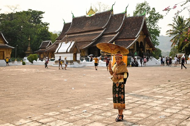 1_LAO_LuangPrabangUNESCO_01242024.4.jpg A tourist visits the Haw Pha Bang temple in the grounds of the Palace Museum in Luang Prabang, Laos, Sept. 8, 2014. (Mark Baker/AP)
