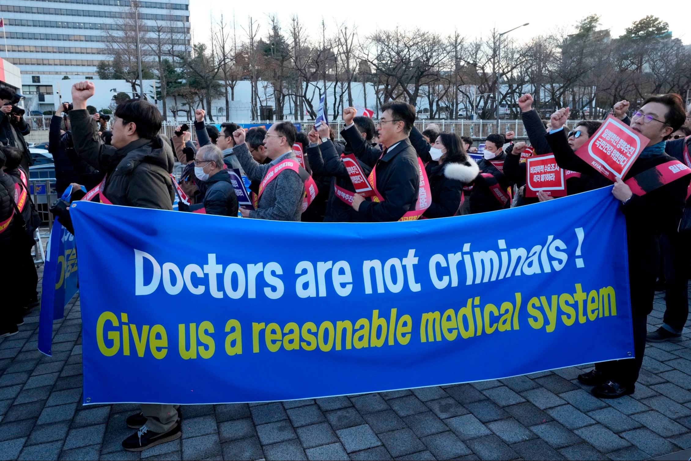 Doctors stage a rally against the government’s medical policy near the presidential office in Seoul